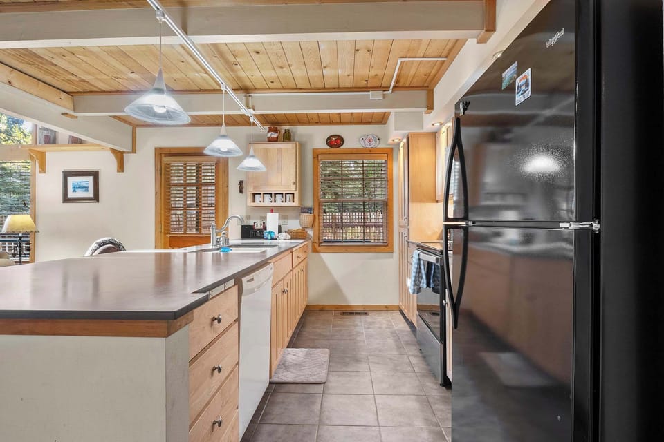 Full kitchen with drip coffee maker, blender, electric stovetop, slow cooker and more