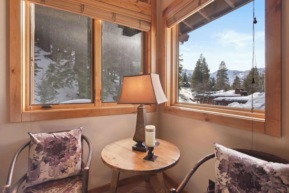 Master bedroom seating area with mountain views