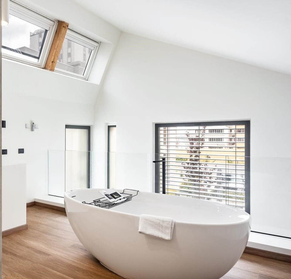 Deluxe Loft | Bathroom | Hair dryer, bidet, towels, soap
