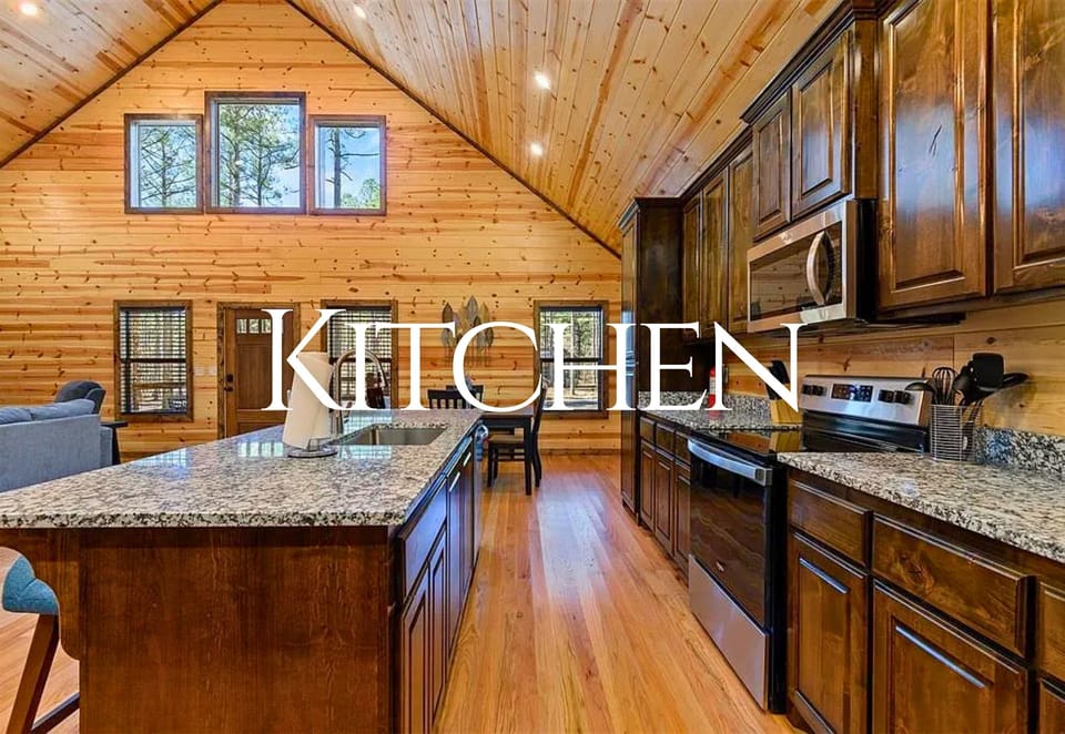 The fully equipped kitchen features stainless steel appliances, granite countertops, and ample space to cook up a delicious meal with family and friends.