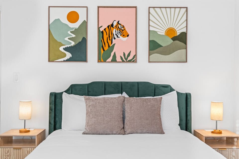 Cozy Bedroom w/ velvet bed and art