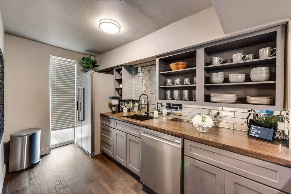 Spacious kitchen with sleek, modern appliances, fully equipped for all your cooking and dining needs.