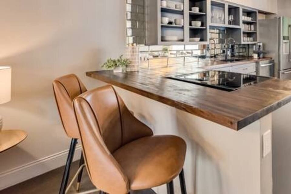 Stylish bar seating at the bar, perfect for casual meals or chatting with the chef.