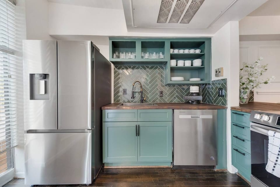 Spacious kitchen with sleek, modern appliances, fully equipped for all your cooking and dining needs.
