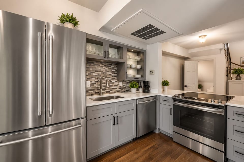 Spacious kitchen with sleek, modern appliances, fully equipped for all your cooking and dining needs.
