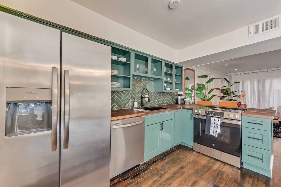 Spacious kitchen with sleek, modern appliances, fully equipped for all your cooking and dining needs.