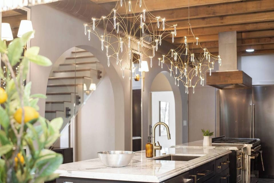 Enjoy views of the chef’s kitchen, featuring two elegant marble countertop islands, perfect for cooking and entertaining.