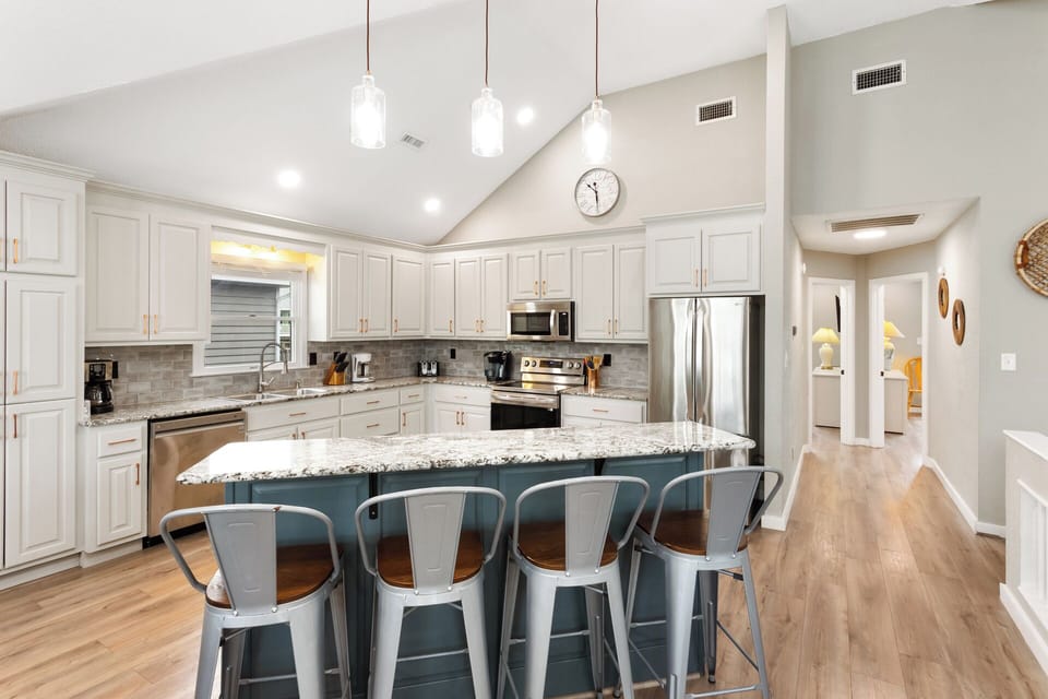 A spacious Kitchen with stainless steel appliances and two Dining Areas make it easy to enjoy meals together.