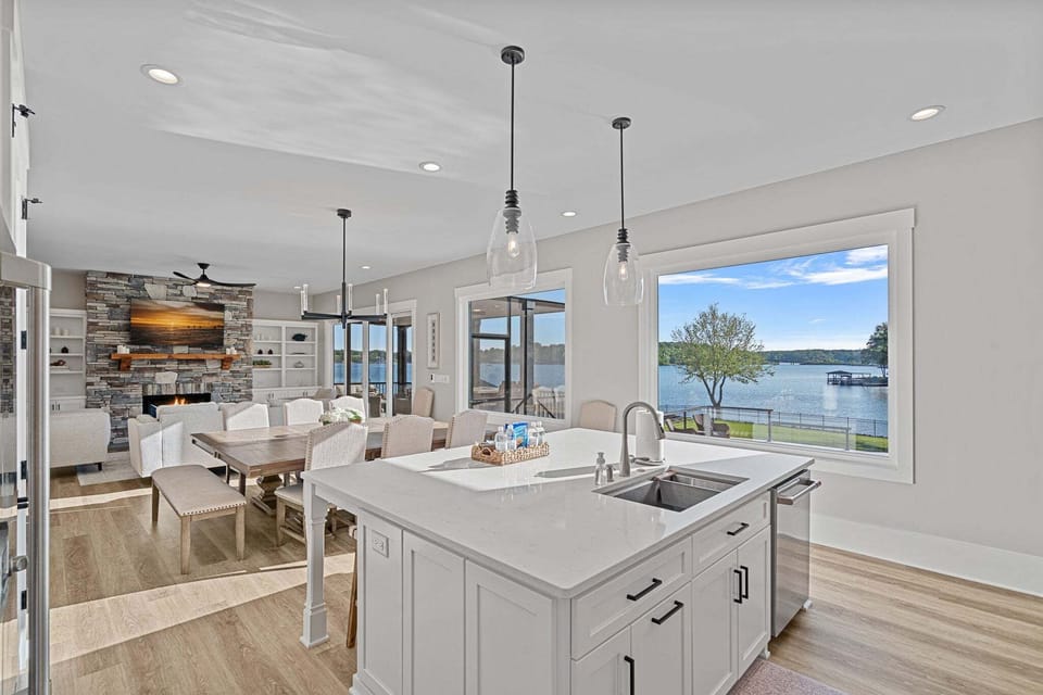 Open concept living, dining and kitchen with lake views.