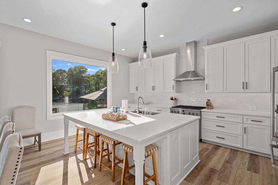 Fully stocked kitchen with island to prep all your group meals & seating for 2.