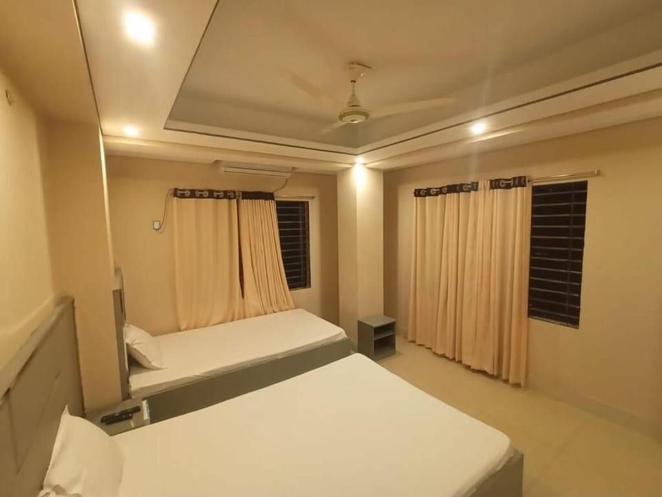 Deluxe Triple Room, City View | In-room safe, desk, laptop workspace, free WiFi