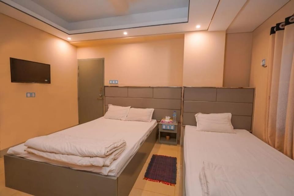 Deluxe Triple Room, City View | In-room safe, desk, laptop workspace, free WiFi