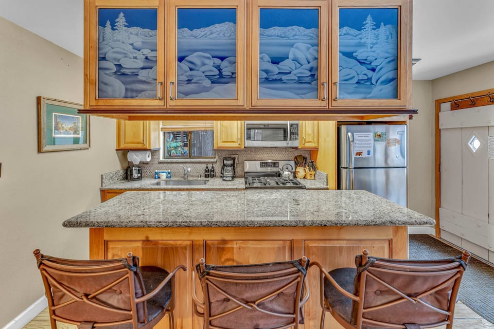Kitchen: Main floor, drip coffee maker, Crockpot, toaster, cooking utensils