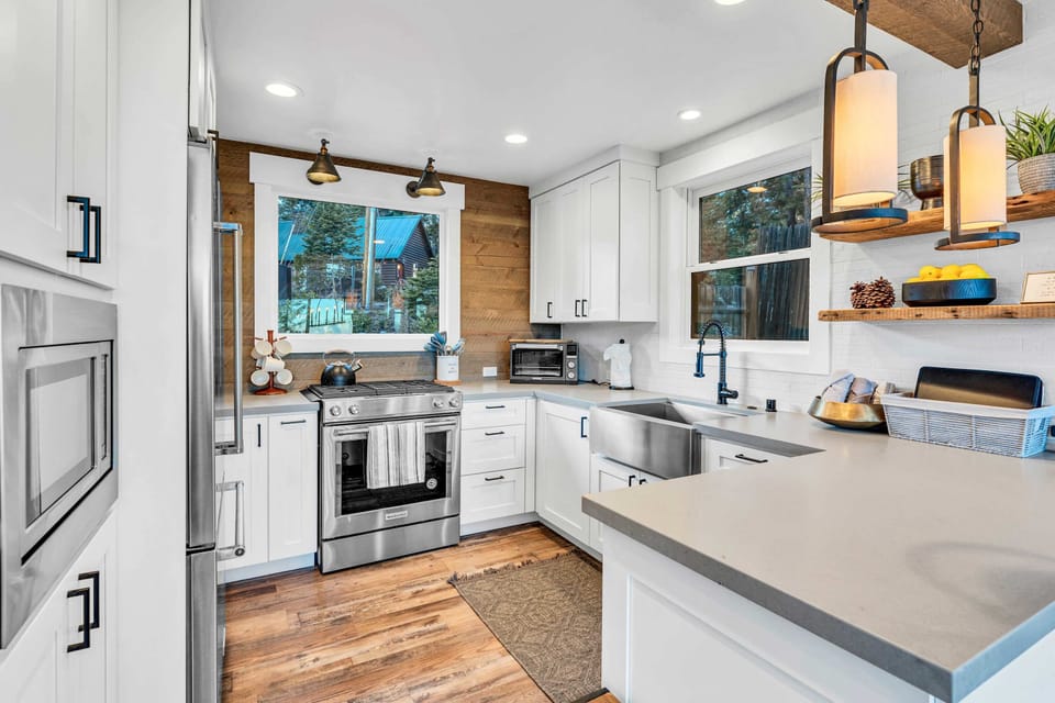 Kitchen: Keurig, toaster, drip coffee maker,  cooking utensils, tableware, toaster oven