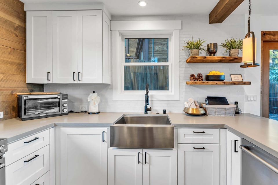 Kitchen: Keurig, toaster, drip coffee maker,  cooking utensils, tableware, toaster oven