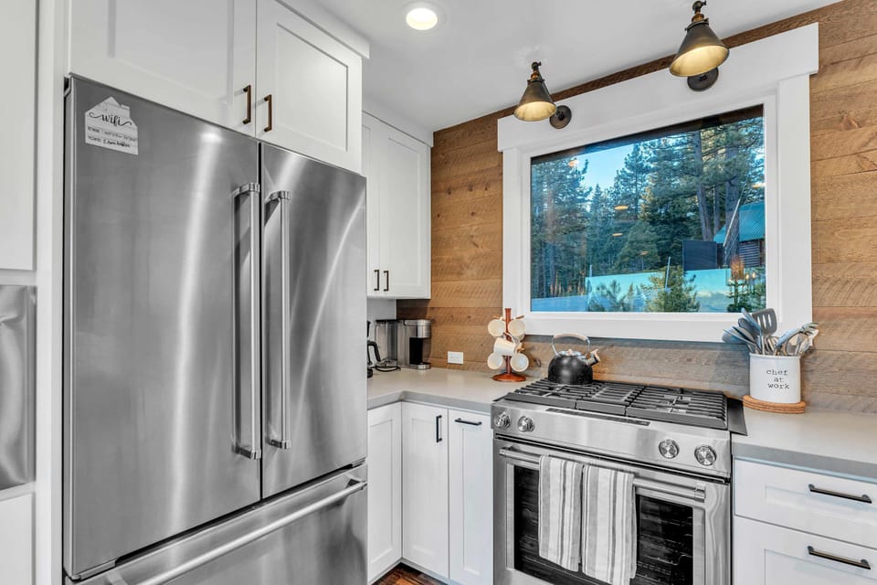 Kitchen: Keurig, toaster, drip coffee maker,  cooking utensils, tableware, toaster oven