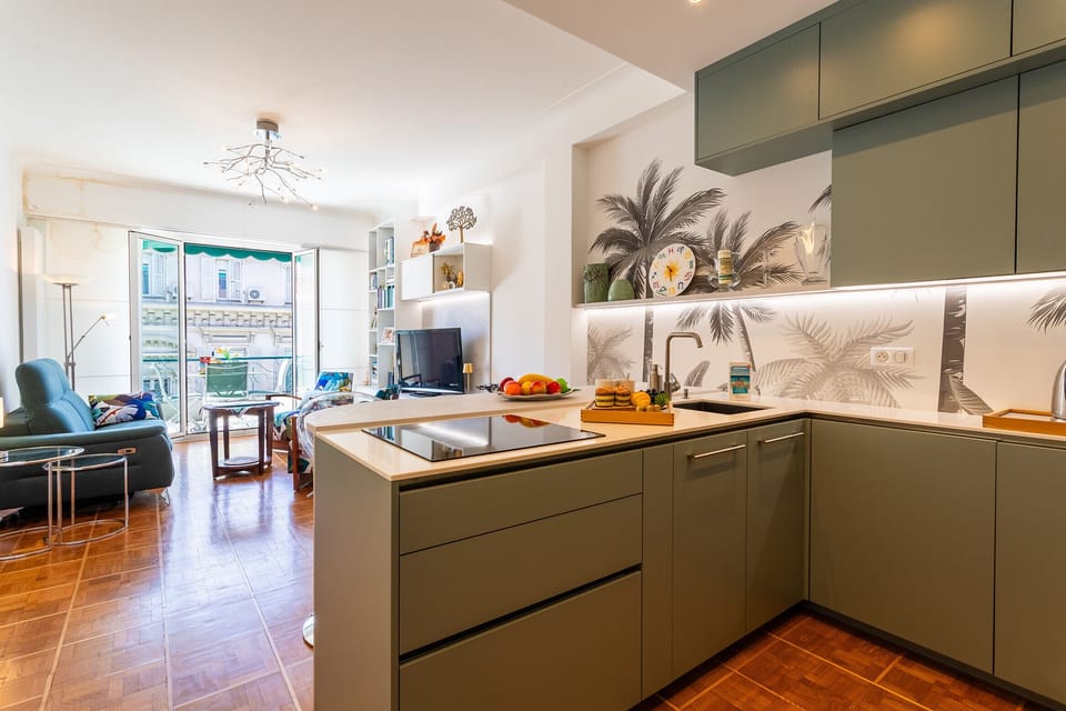 View from the open kitchen to a bright, modern living room. The space offers warm and inviting moments with a stylish ambiance.