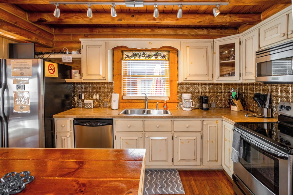 Rustic-modern kitchen featuring stainless steel appliances, warm wood accents, and everything you need to feel right at home.