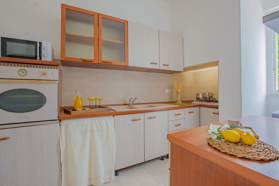 Interior Design, Flooring, Wood, Kitchen, Furniture, Countertop, Floor, Kitchen Appliance, Major Appliance, Room