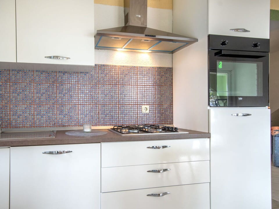 Kitchen, Countertop, Kitchen Appliance, Major Appliance, Interior Design, Cabinetry, Flooring, Kitchen Stove, Stove