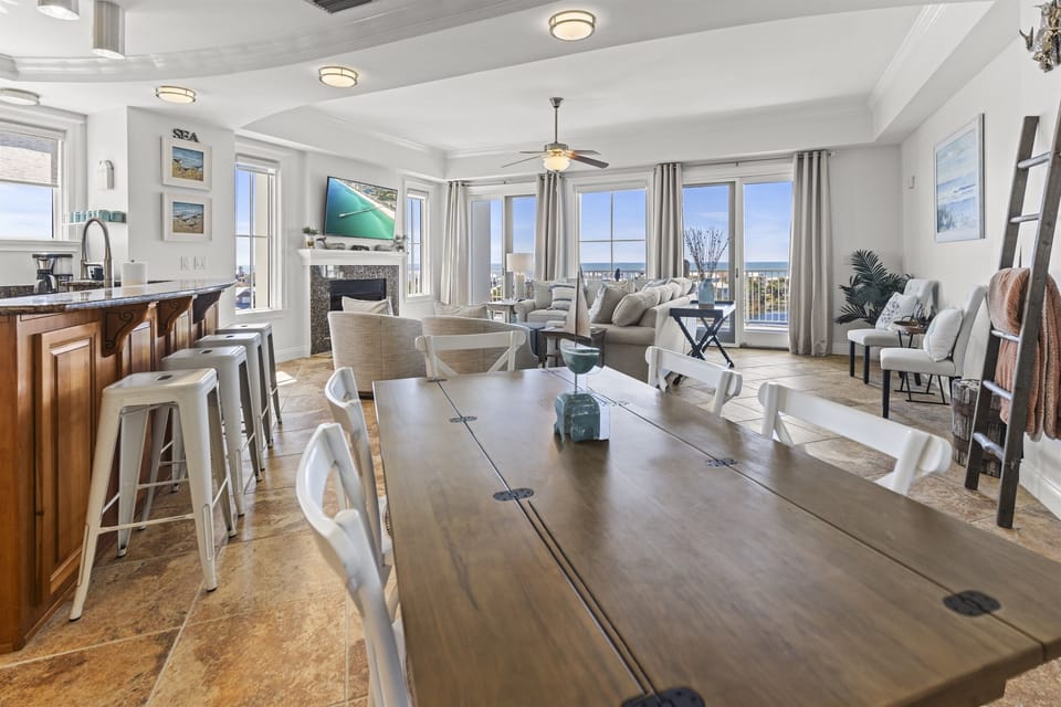 Your spacious open-plan retreat flows seamlessly from kitchen to dining to living, with stunning city views framing every moment of your stay.