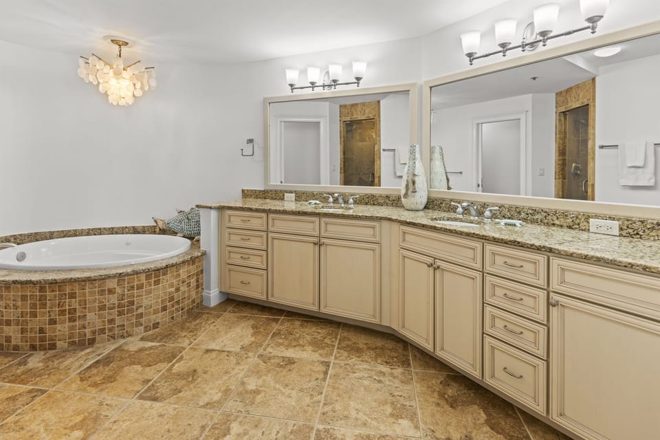 Indulge in your private spa-like retreat with elegant granite counters, dual vanities, and a luxurious soaking tub perfect for unwinding after your adventures.