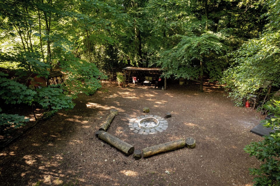 Main clearing with brick built firepit