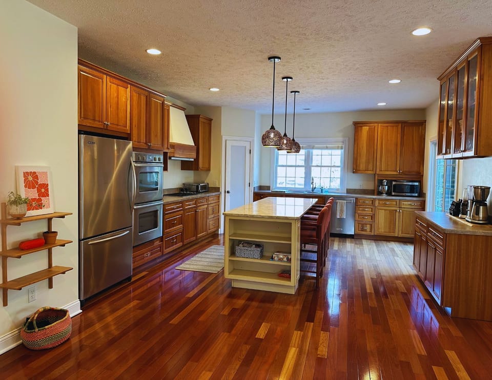 Generous kitchen designed for entertaining and connection.