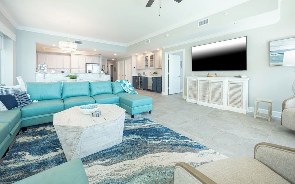 Gather in this welcoming living space and enjoy stunning beach views through the windows