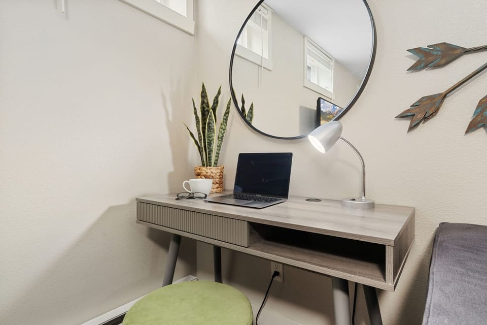 Living Area with Smart TV and Laptop-friendly Workspace (lower level)