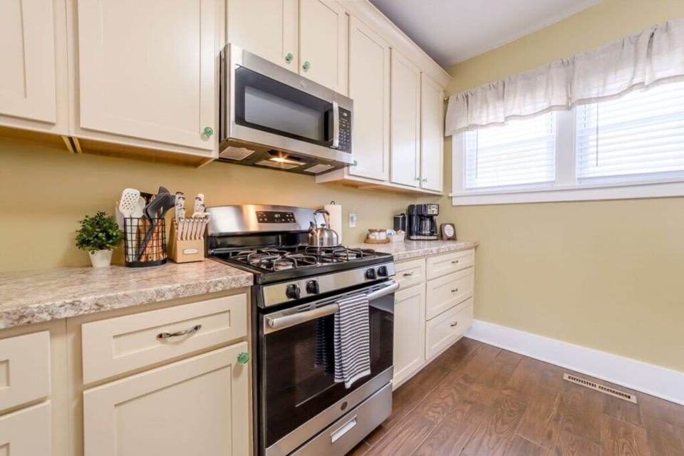 Fully stocked kitchen with gas stove.
