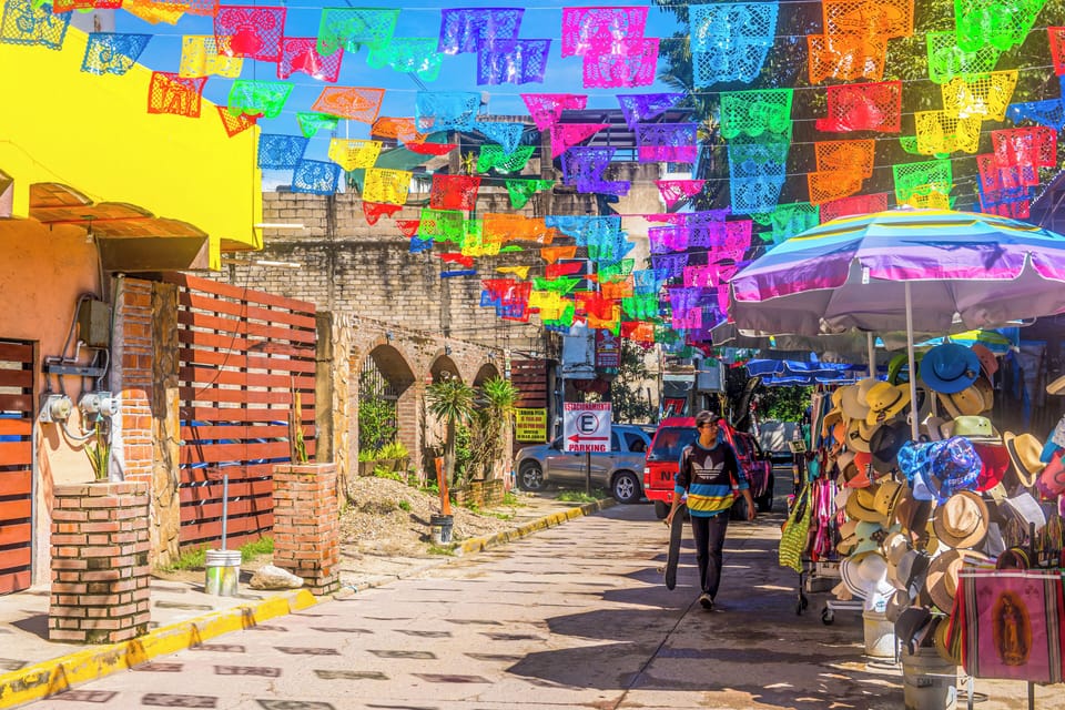 A picturesque street in Sayulita, lined with charming shops and cafes.