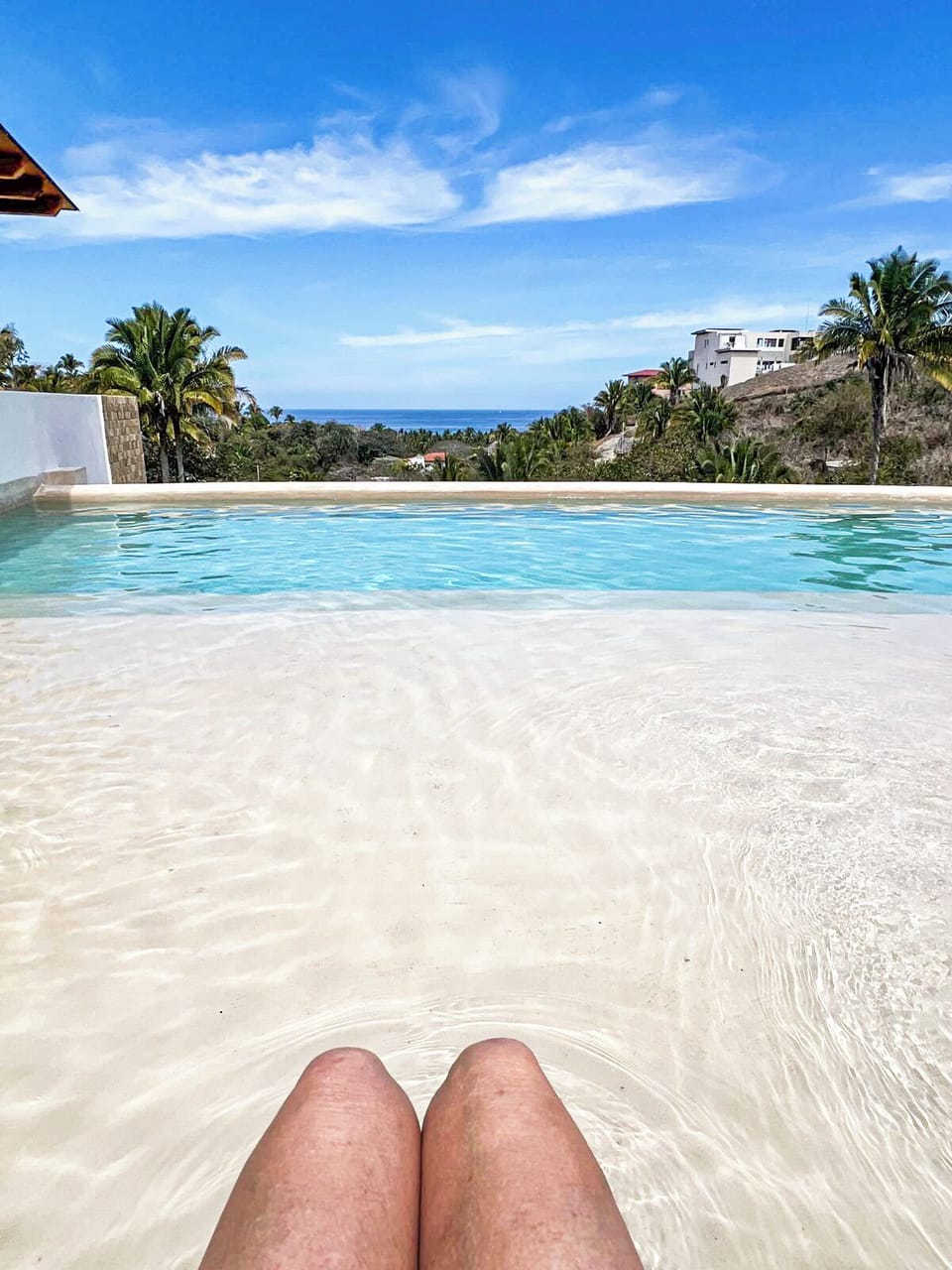 Imagine yourself lounging by the pool, capturing the serene ocean.