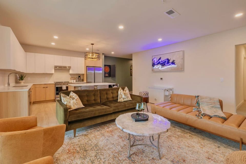 Living Room: features a cozy seating area with plush and earth-toned furniture.