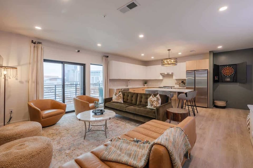 Living Room: features a cozy seating area with plush and earth-toned furniture.