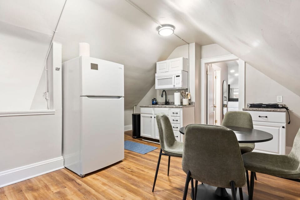 Spacious dining nook connects to kitchen, perfect for meals together.