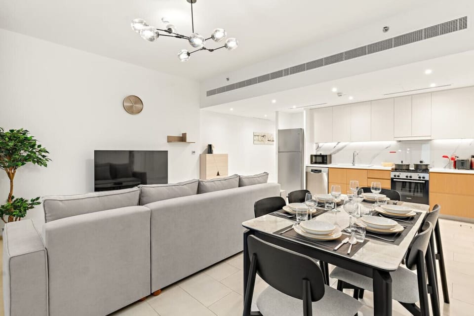 Living Room: Modern elegance awaits with stylish decor and ample space for relaxation and dining!