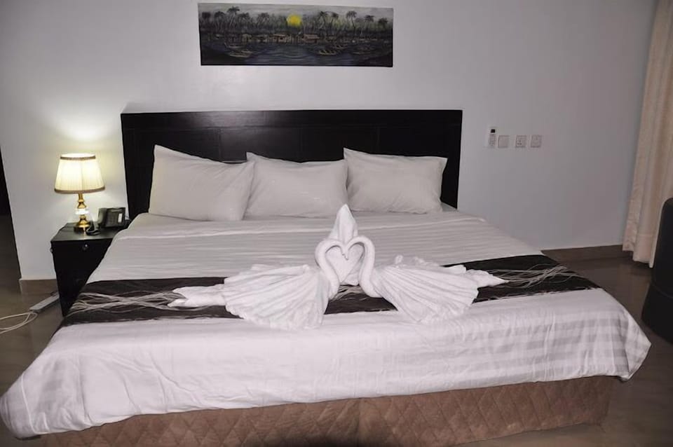 Economy Room, Balcony, City View | Desk, laptop workspace, blackout drapes, soundproofing
