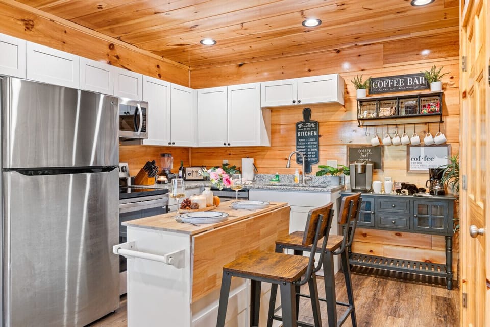 A kitchen that is spacious, modern, and fully stocked for your getaway.