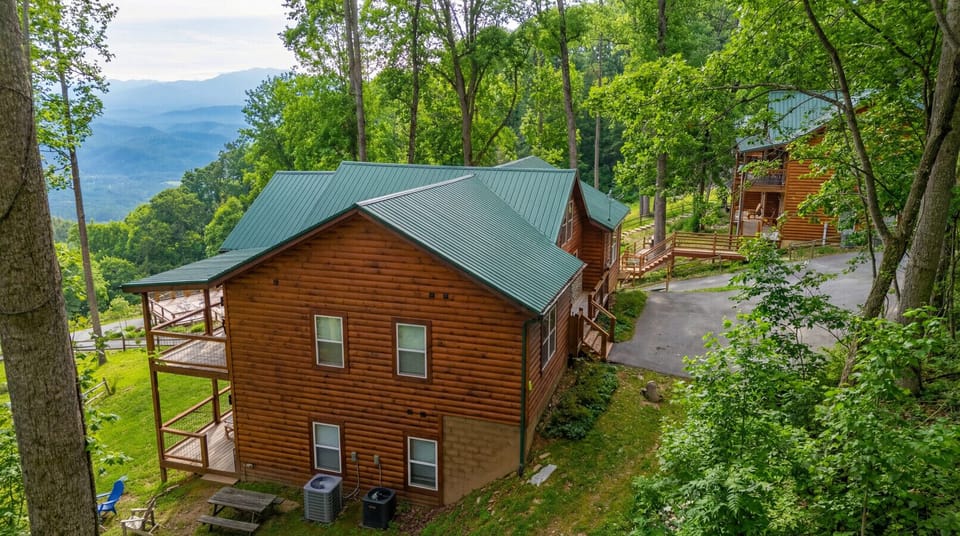 Two luxury cabins – sleeps 24, indoor pools, and breathtaking Smoky Mountain views.