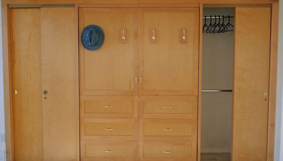 Custom solid maple and birch Murphy bed. Thick, comfortable Queen size mattress.