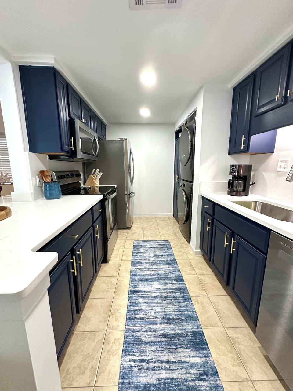 Full size refrigerator, washer and dryer.