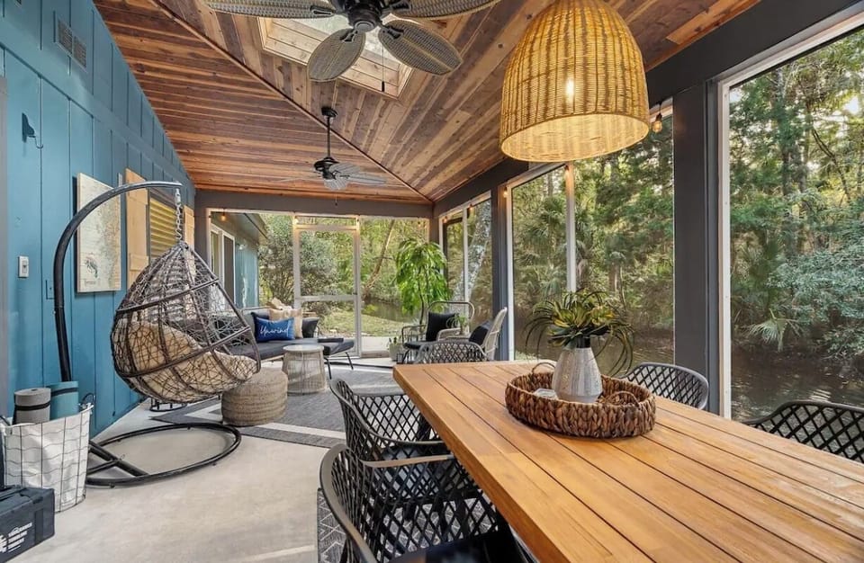 Screened porch sits directly alongside canal. 