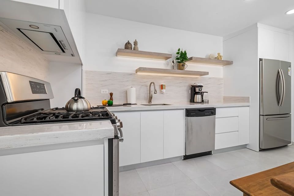 Designed for effortless cooking and dining, this modern kitchen flows beautifully into the adjacent dining space.