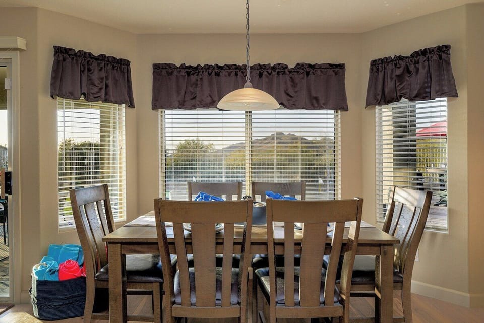 Dinner with a View! Enjoy meals at this spacious dining table for 8, all while taking in the stunning backyard scenery. The perfect spot for gathering and making memories!