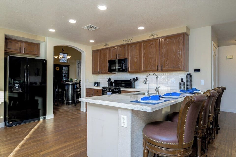 Chef's Delight! This spacious, well-stocked kitchen features counter seating - perfect for cooking and gathering!