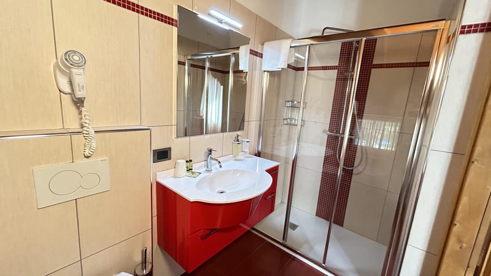 Shower, hair dryer, bathrobes, slippers