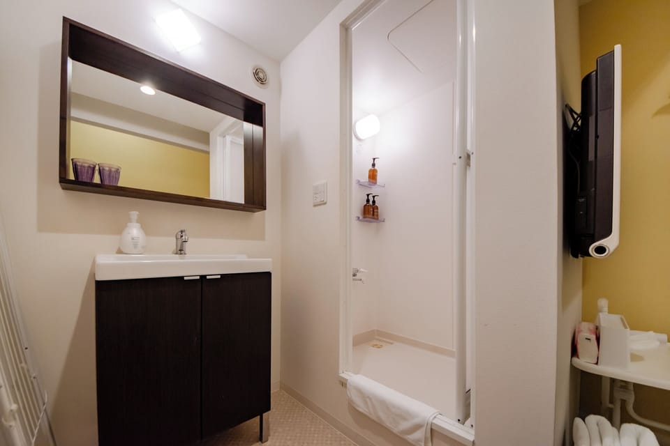 Double Room, Non Smoking | Bathroom | Shower, hair dryer, slippers, towels