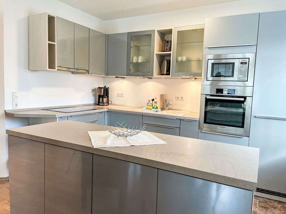 Cabinetry, Kitchen, Kitchen Appliance, Countertop, Furniture, Interior Design, Major Appliance, Flooring, Home Appliance, Wood