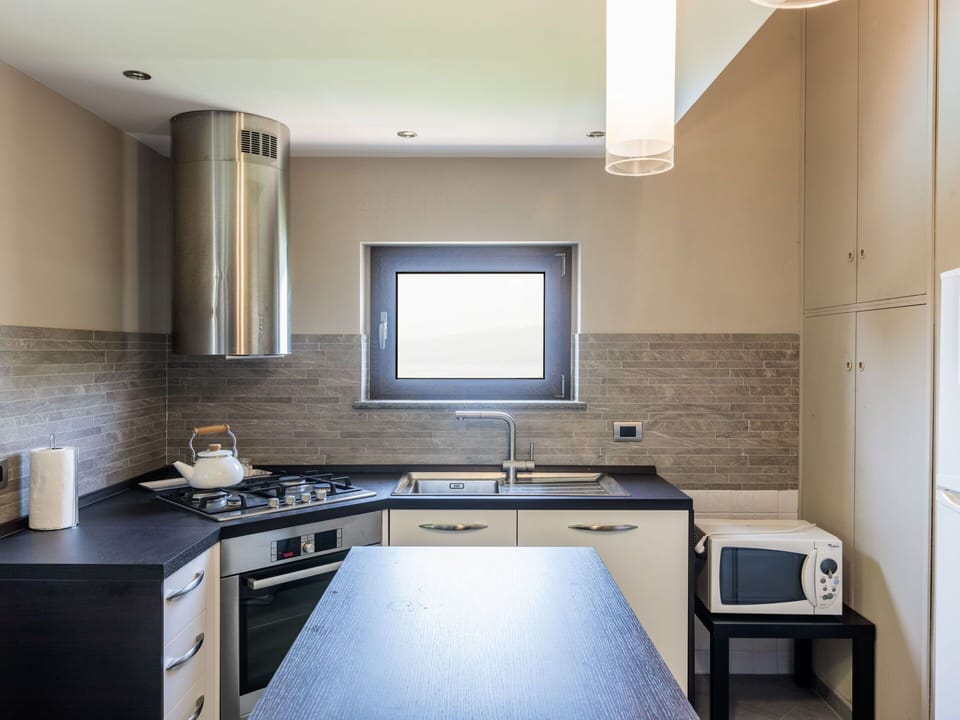 Kitchen, Kitchen Appliance, Countertop, Interior Design, Major Appliance, Flooring, Wood, Furniture, Ceiling, Light Fixture